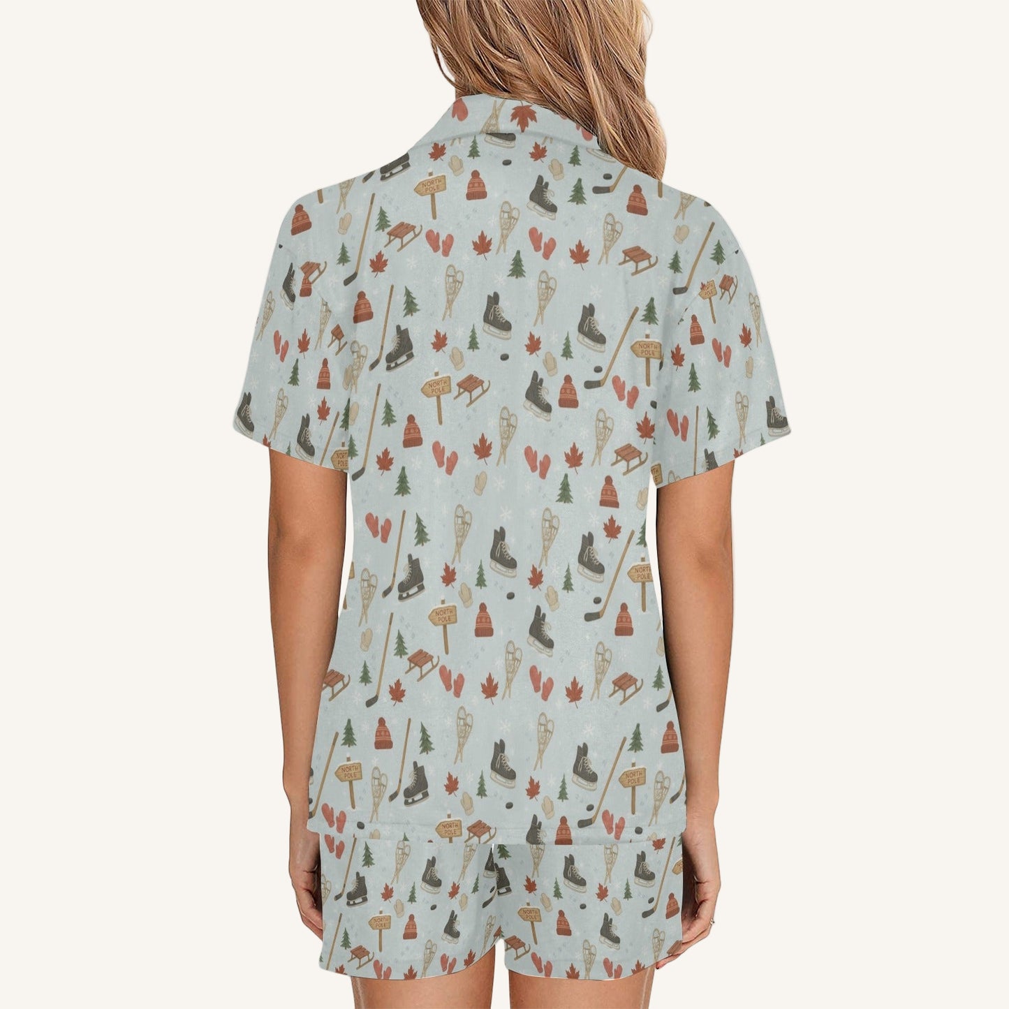 Woman wearing a short-sleeve shirt with nature-themed pattern on a white background